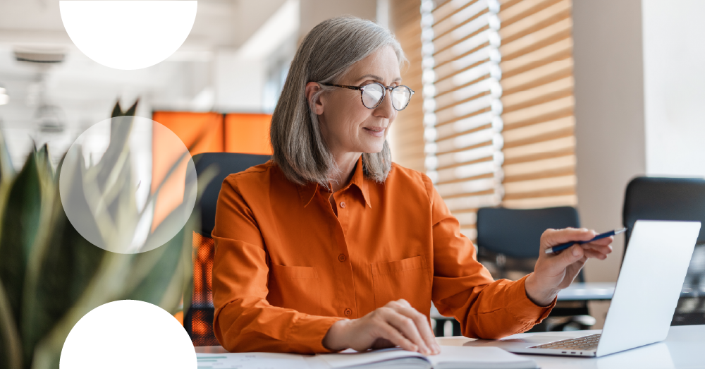 Photo of lady sat with a laptop